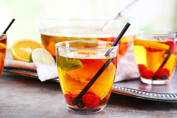 Fruity punch in glassware on metal tray, closeup — Stock Photo, Image