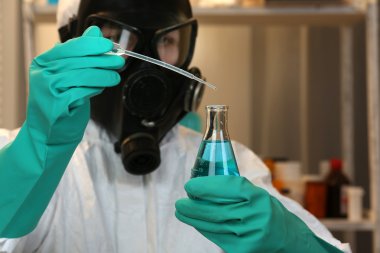 Chemist working in drug laboratory clipart
