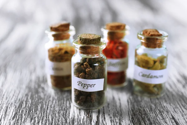 Assortment of spices in glass bottles — Stock Photo, Image