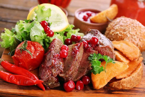 Meat with cranberry sauce — Stock Photo, Image