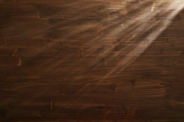 Wiązka światła na tle drewniane — Zdjęcie stockowe