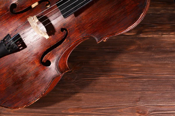 Violoncello vintage su sfondo di legno — Foto Stock