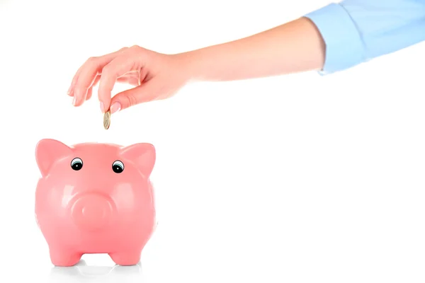 Mano insertando dinero en alcancía aislada en blanco — Foto de Stock