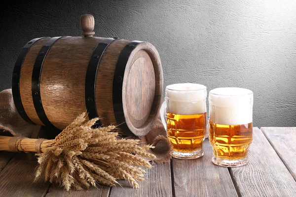 Beer barrel with beer on table