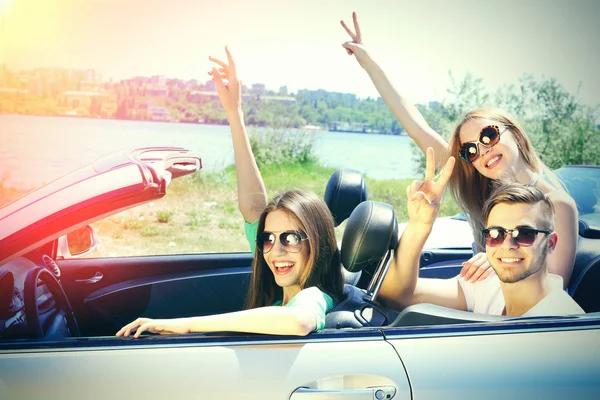 Three friends in cabriolet, outdoors — Stock Photo, Image