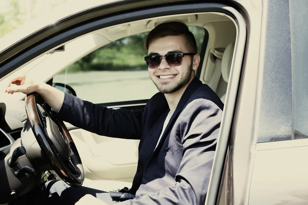 Young man in cabriolet — Stock Photo, Image