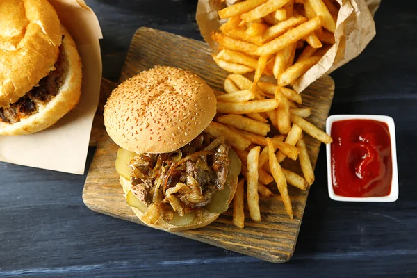 Tasty burger and french fries — Stock Photo, Image