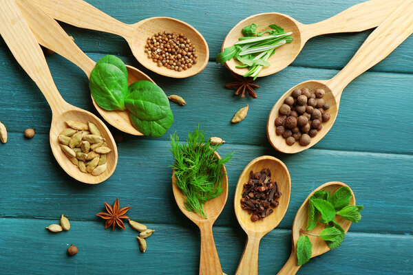 wooden spoons with fresh herbs