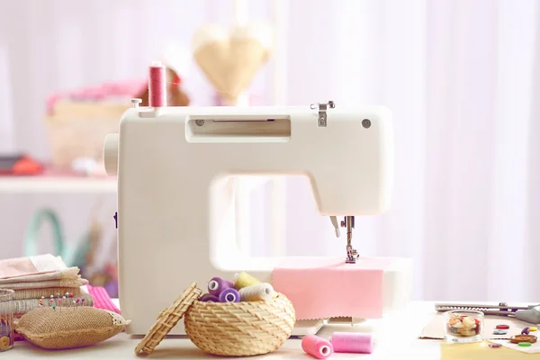 Sewing machine on table — Stock Photo, Image