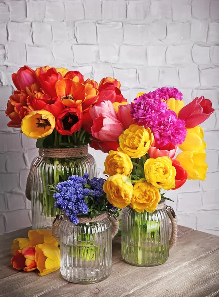 Beautiful flowers in vases — Stock Photo, Image