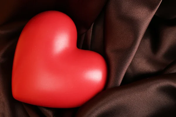 Red heart on fabric background — Stock Photo, Image