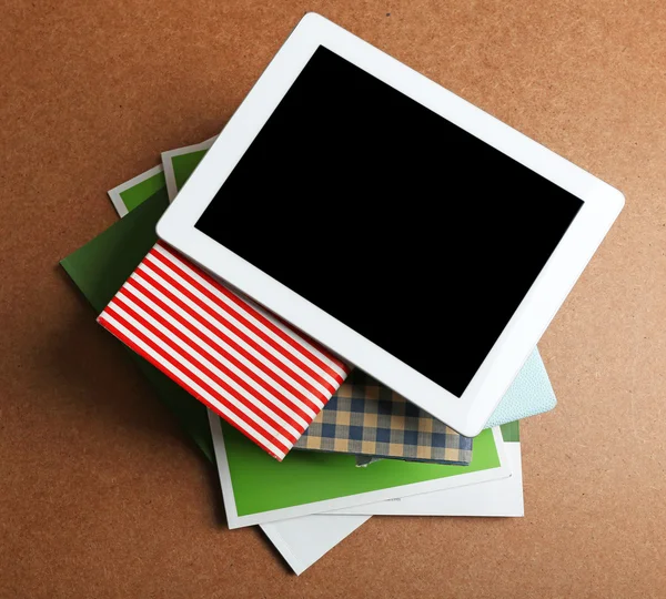 Notebook on top of pile of books — Stock Photo, Image