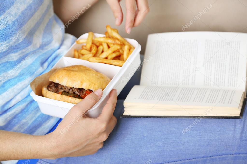 Woman with unhealthy fast food