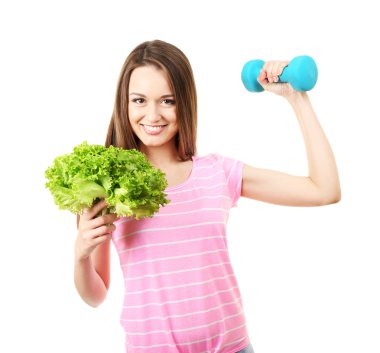 Marul ve üzerinde beyaz izole dumbbell ile sağlıklı genç kadın