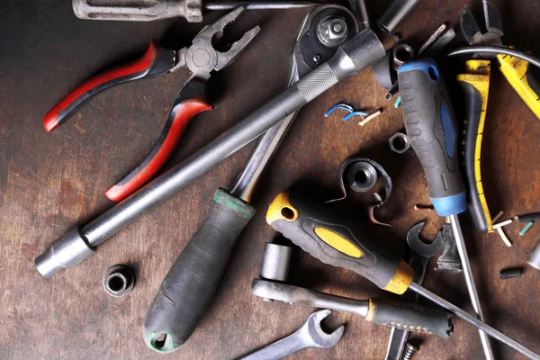 Different tools on workplace in garage — Stock Photo, Image