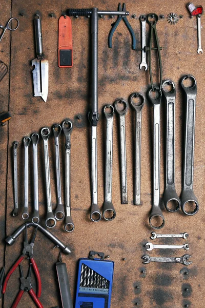 Different tools on workplace in garage — Stock Photo, Image