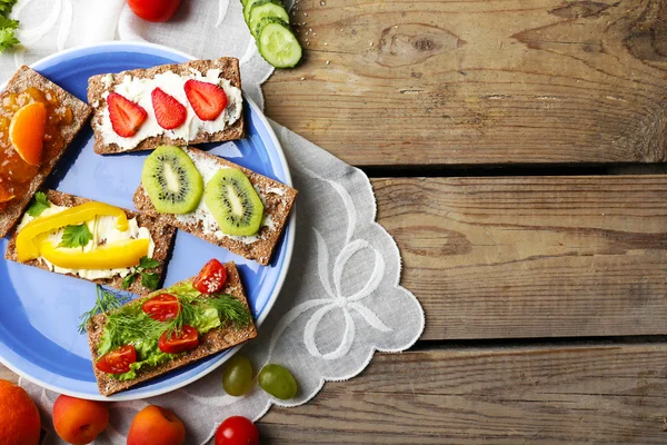 Still life with vegetarian sandwiches on wooden table — Stock Photo, Image