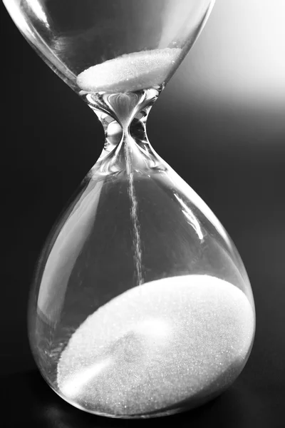 Hourglass on dark background — Stock Photo, Image
