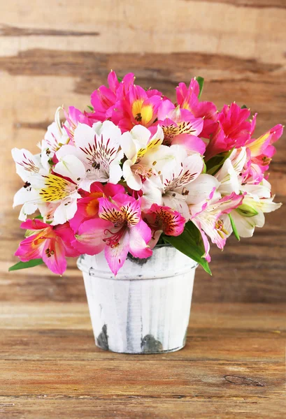 Bouquet of alstroemeria on wooden background — Stock Photo, Image