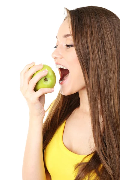 Gezonde jonge vrouw met groene appel geïsoleerd op wit — Stockfoto