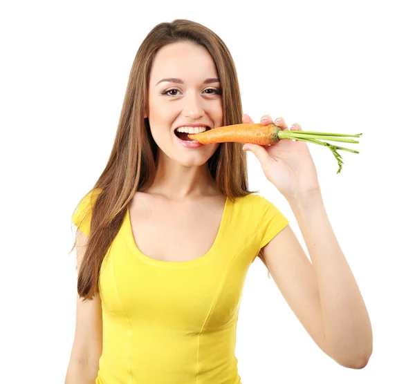 Healthy young woman eating carrot isolated on white — Stockfoto