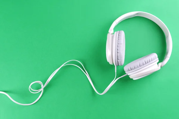 Headphones on green background — Stock Photo, Image