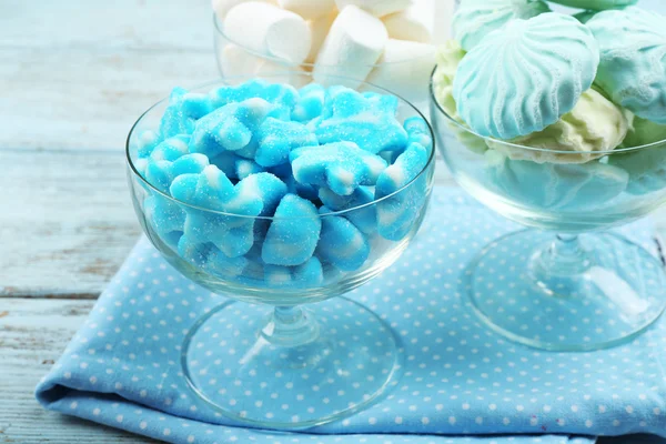 Sweet candies in glassware on napkin, closeup — Stock Photo, Image