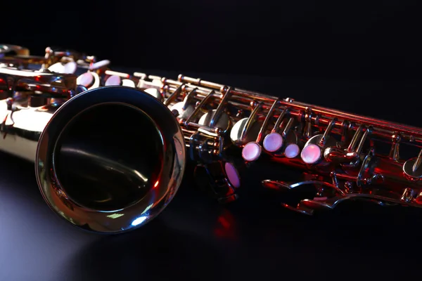 Golden saxophone on dark background — Stock Photo, Image