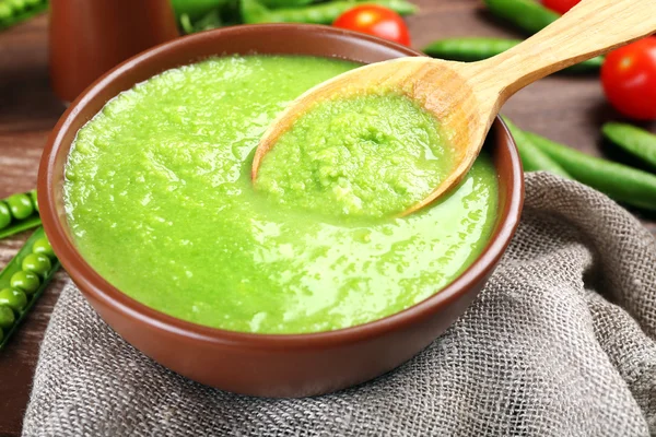 Tasty peas soup on table close up — Stock Photo, Image