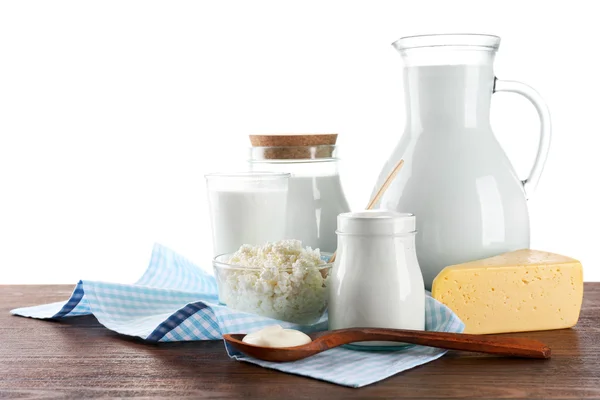 Produits laitiers sur table en bois sur fond blanc — Photo