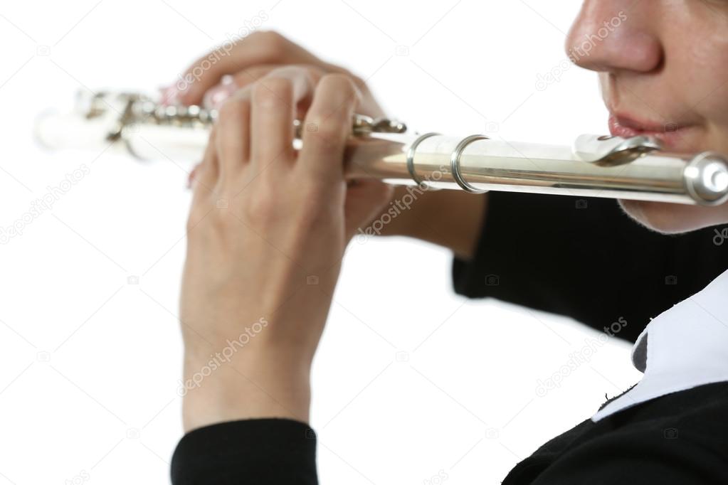 Musician playing flute isolated on white