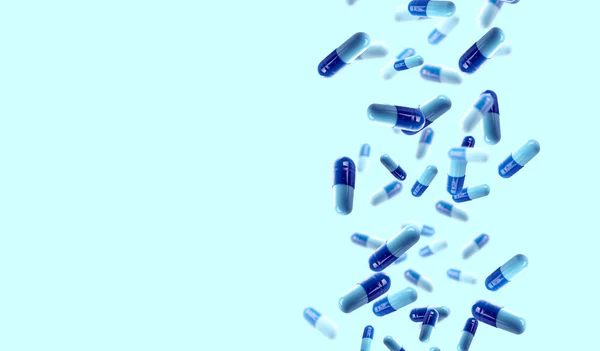 Fallande medicinska piller på blå bakgrund — Stockfoto