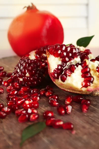 Pomegranate seeds on  table — Stock Photo, Image