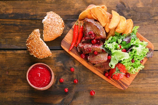 Meat with cranberry sauce — Stock Photo, Image