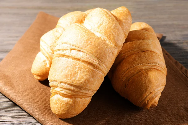 Delicious croissants on table — Stock Photo, Image