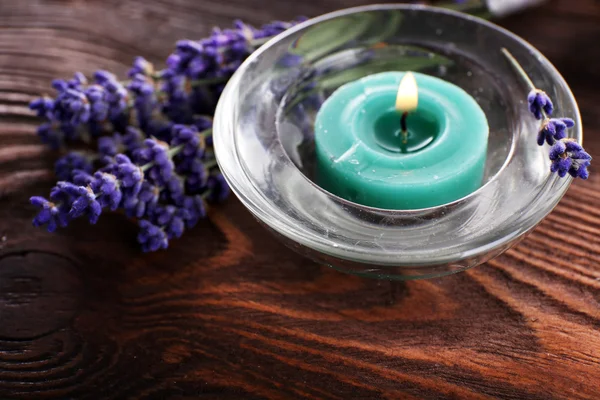 Spa still life with candlelight and fresh lavender on wooden table, closeup — 图库照片