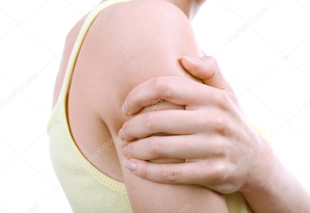 Young woman with shoulder pain isolated on white