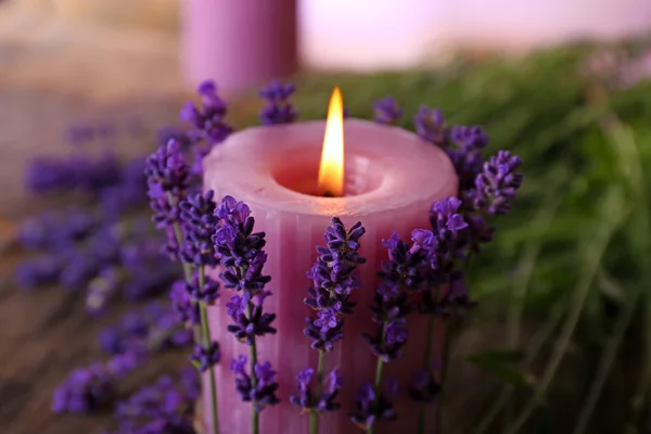 Candles with lavender flowers on table close up — Stock Photo, Image