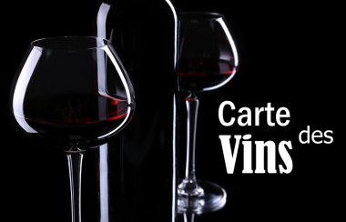 Wineglasses with red wine on black background