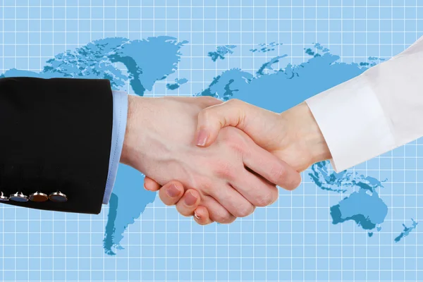 Business handshake on world map background — Stock Photo, Image