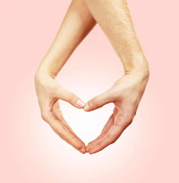 Hands in shape of heart on light background — Stock Photo, Image