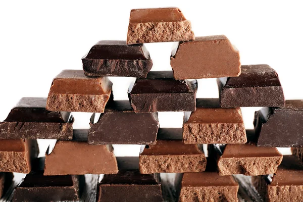 Pyramid of squared chocolate on wooden table — Stock Photo, Image