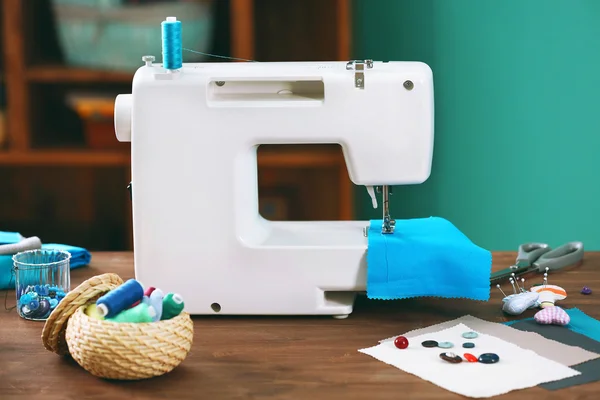 Sewing machine on table in workshop — Stock Photo, Image