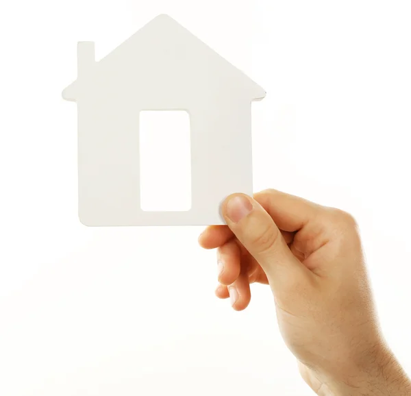 Feminino mão segurando casa isolada no branco — Fotografia de Stock