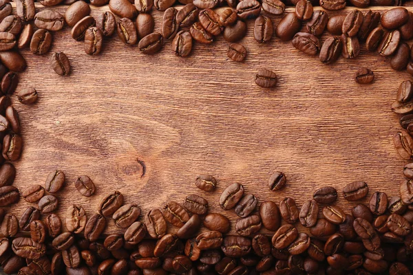 Coffee beans on wooden background — Stock Photo, Image