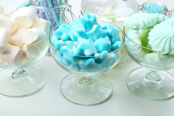 Sweet candies in glassware on table, closeup — Stock Photo, Image