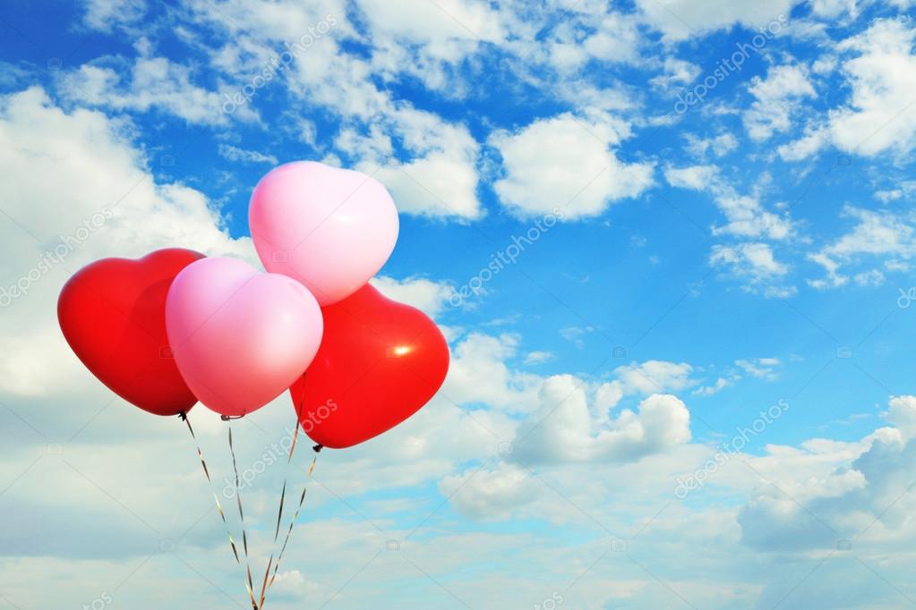 Love heart balloons on sky background Stock Photo by ©belchonock 77194093