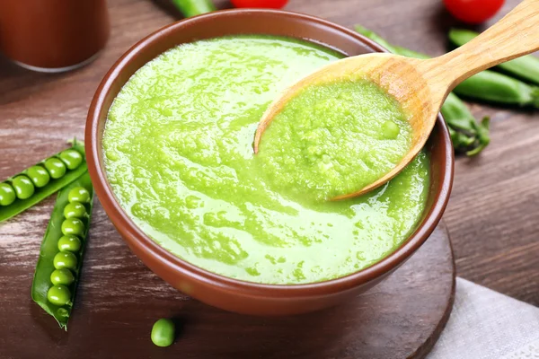 Tasty peas soup on table close up — Stock Photo, Image