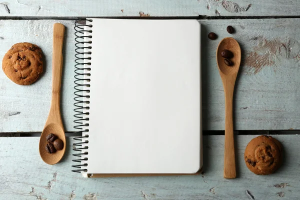 Open recipe book on wooden background — Stock Photo, Image
