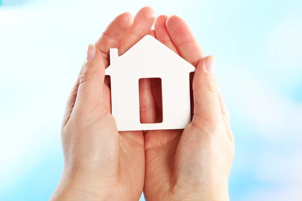 Female hands holding model of house — Stock Photo, Image